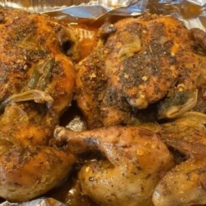 A close up of some chicken on foil