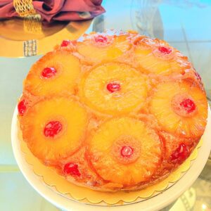 A pineapple upside down cake sitting on top of a table.