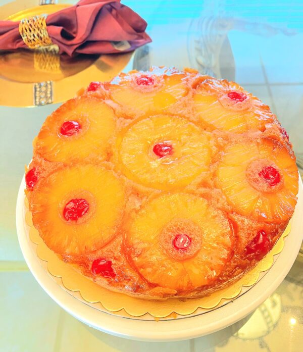 A pineapple upside down cake sitting on top of a table.