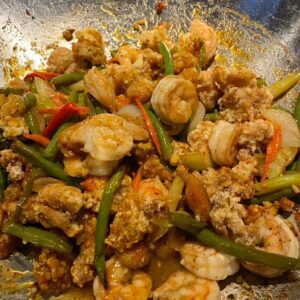 A plate of food with shrimp and rice.