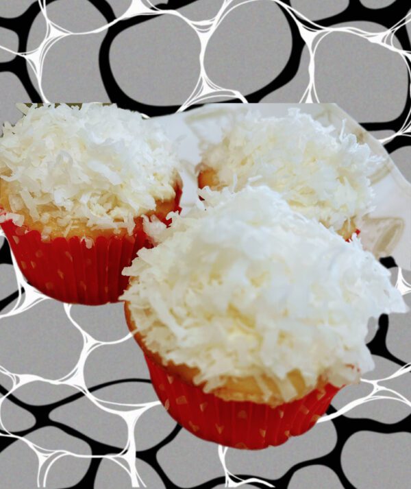 Three cupcakes with white frosting on top of a black and white background.