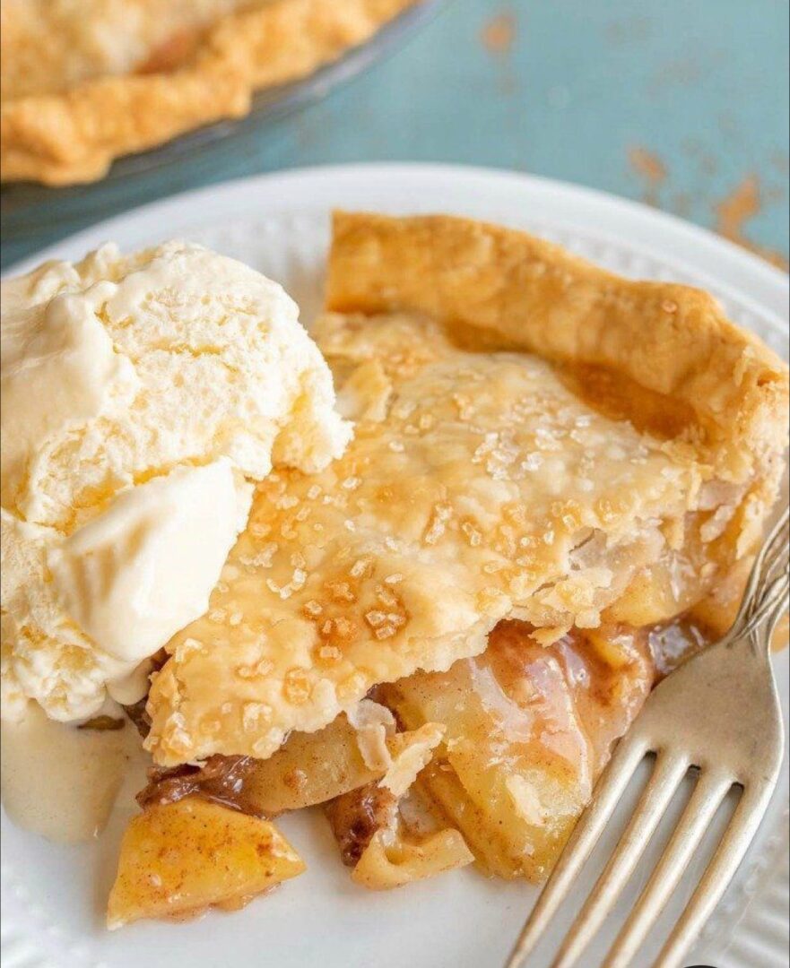 A close up of a slice of pie on a plate