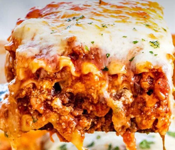 A close up of lasagna with cheese on top