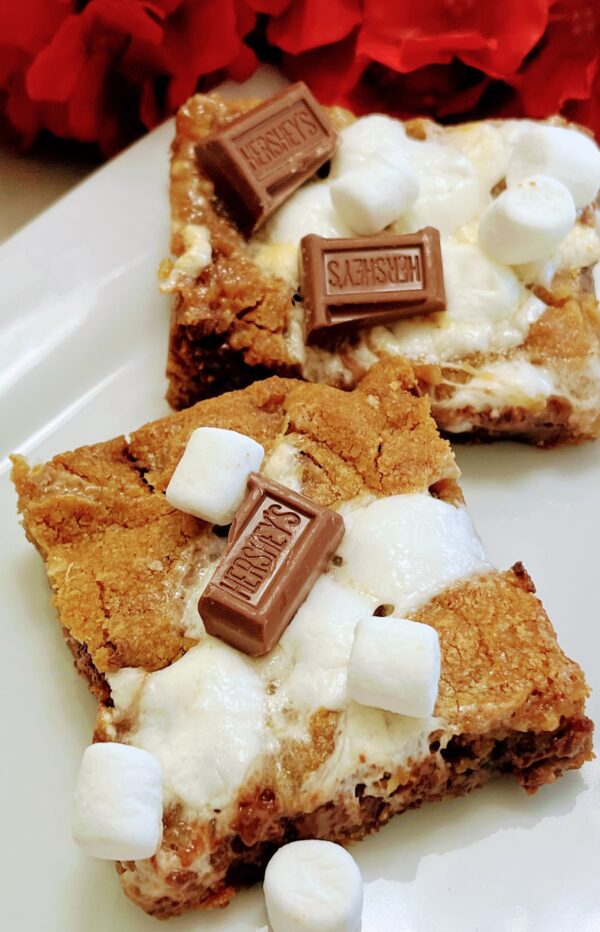 A close up of some bars with marshmallows and chocolate